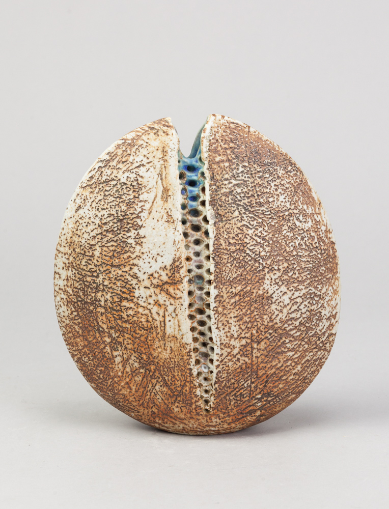 ALAN WALLWORK (1931- 2019); a stoneware split pebble with impressed decoration forming the parting