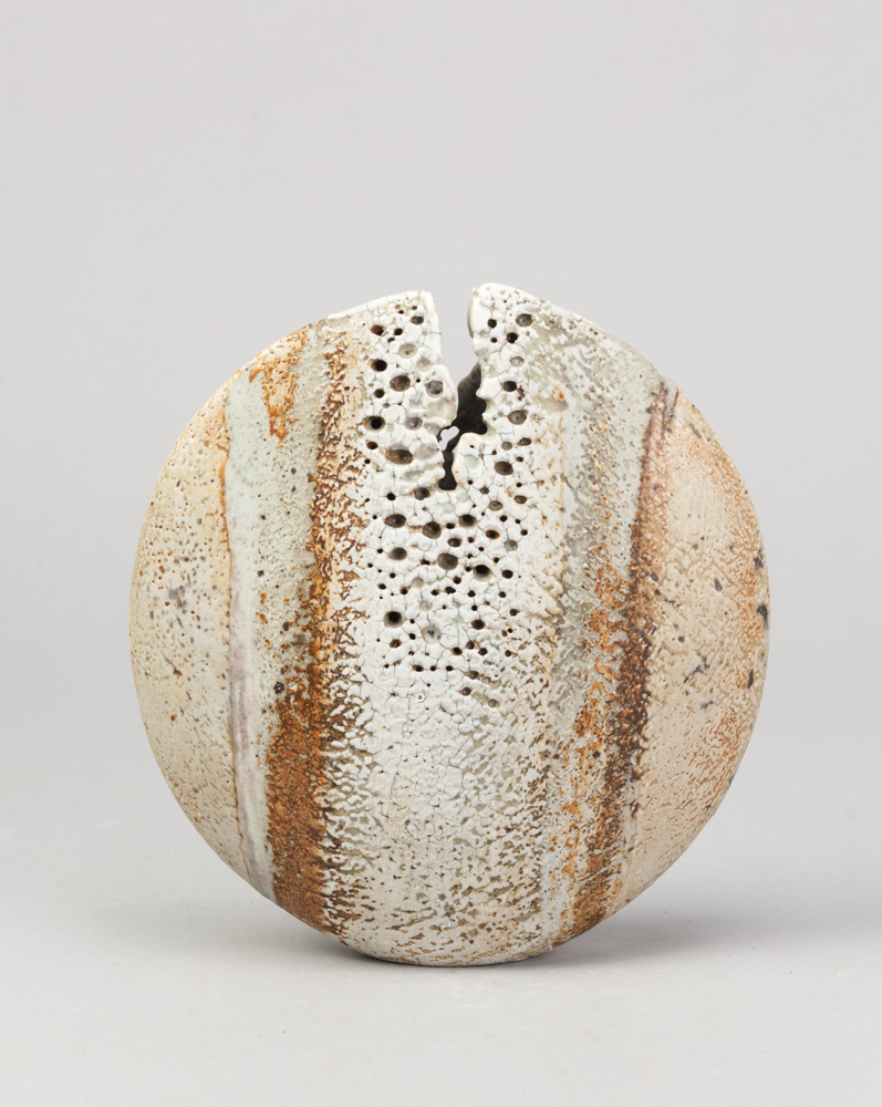 ALAN WALLWORK (1931- 2019); a stoneware split pebble with impressed decoration around the parting,