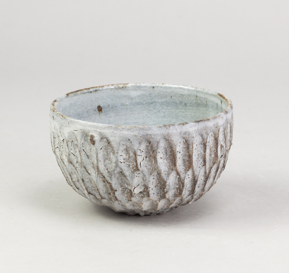 AKIKO HIRAI (born 1970); a small stoneware flower petal bowl covered in dry kohiki glaze, painted
