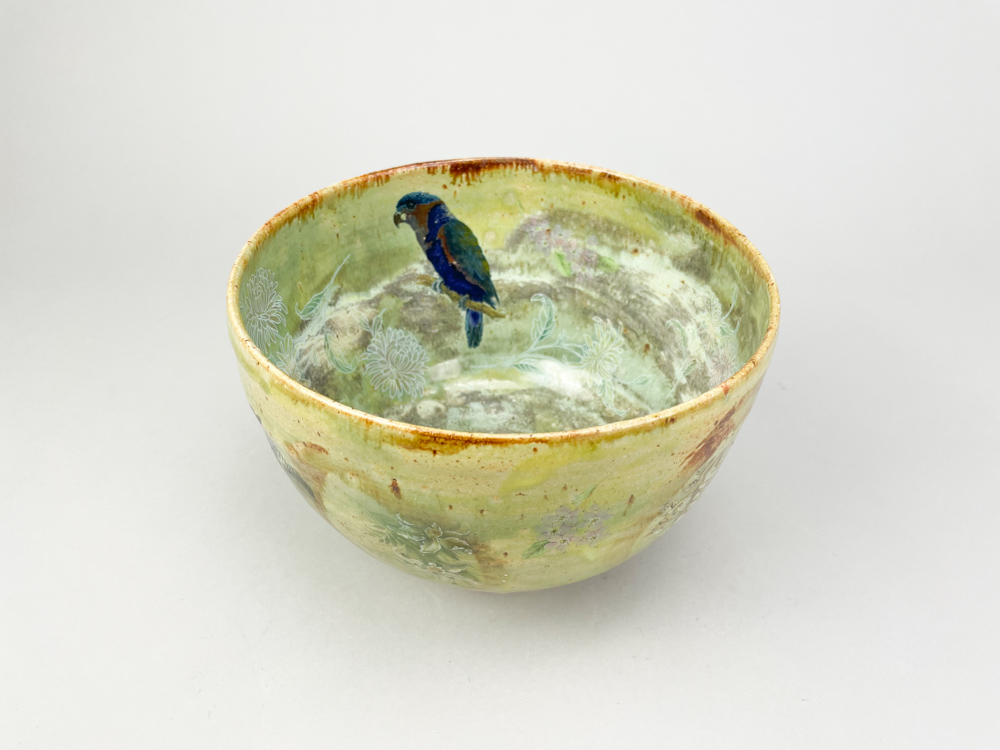 ANDREW CHAMBERS; a deep stoneware bowl covered in green glaze with decals of a parrot, leopard and - Image 5 of 6