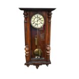 A walnut cased twin weight Vienna wall clock,