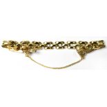 An Italian 9ct gold three bar link bracelet with push-in clip fastener and gold safety chain,