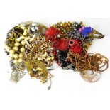 A large quantity of costume jewellery to include coloured beads, necklaces, bangles, earrings,