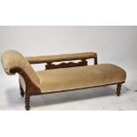 An Edwardian mahogany chaise longue with scroll back and open arm,