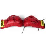 BOXING; a pair of Everlast boxing gloves bearing numerous signatures including Muhammad Ali,