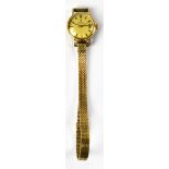 OMEGA; a 9ct gold ladies' wristwatch, the dial set with Roman numerals and date aperture, approx 26.