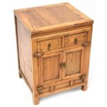 A contemporary reproduction oriental-style hardwood side cabinet with pair of doors over pair of