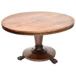 A Regency rosewood circular tilt-top breakfast table on a turned and tapering column with lobed