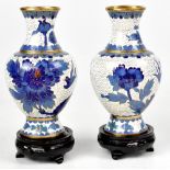 A pair of 20th century cloisonné enamelled vases, bird and foliate decoration, with hardwood stands,