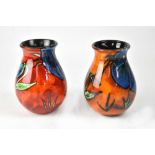 POOLE; two 'Himalayan Poppy' design baluster vases in different colourways,