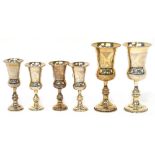 A pair of George V hallmarked silver goblets, with wiggle work engraved decoration,