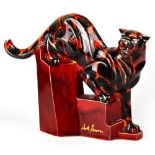 ANITA HARRIS; a large signed ceramic model of a cheetah, on a stylised stepped rocky plinth,