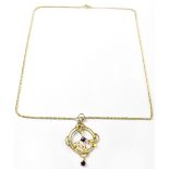 An Edwardian-style yellow metal pendant with small amethyst-coloured stone drop,