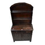 A reproduction Priory-style oak dresser,