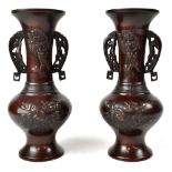 A pair of Chinese bronze twin-handled vases with bird and peony decoration,