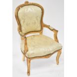 A 20th century gilt framed fauteuil chair with overstuffed seat,
