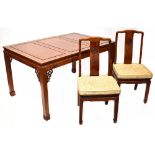 A contemporary Oriental hardwood dining room suite comprising extending dining table with one