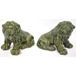A pair of 20th century Chinese thick green glazed pottery temple lions,