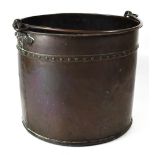 An early 19th century copper swing-handled coal bucket of riveted construction,