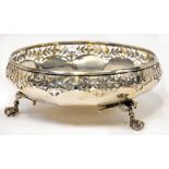 A George V hallmarked silver bowl of circular lobed form, with pierced border of flowers and leaves,