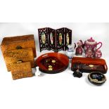 A set of three graduated Chinese hardwood carved boxes,