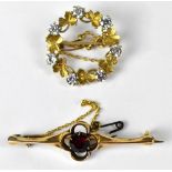 A 9ct gold brooch in the form of a wreath of clover,