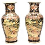 A pair of large 20th century Japanese Satsuma style vases decorated with gilt heightened panels