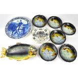 A Majolica-style set of a fish-shaped serving dish and six plates, embossed and decorated with carp,