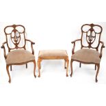 A pair of late 19th/early 20th century walnut armchairs with floral pierced splat,