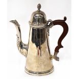 A George V hallmarked silver coffee pot of tapered for, with domed lid and wooden scroll handle,