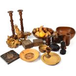 A good collection of treen items to include turned candlesticks, lidded boxes,