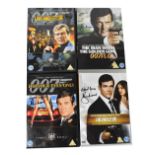 JAMES BOND; four DVDs, each bearing the signature of Roger Moore to the covers (4).