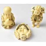 Three Japanese netsuke, one in the form of a double-sided mask surrounded by six masks,