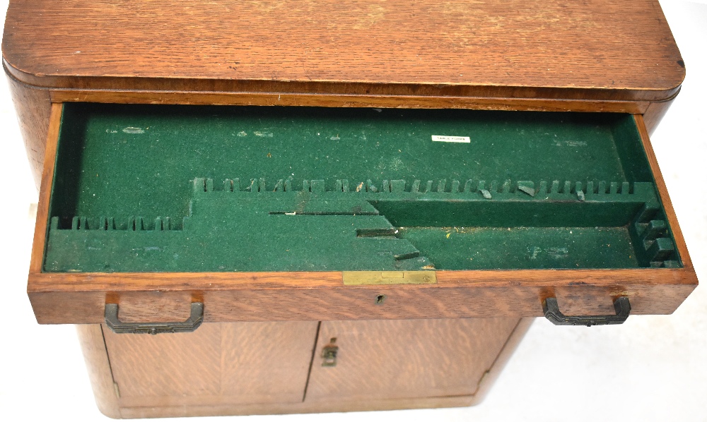 A mid-20th century oak student's desk with fall front and fitted interior above open shelves to the - Image 4 of 4