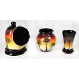 STUDIO POOLE; three ceramics in the 'African Skies' pattern to include a trumpet vase, height 13cm,