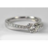 An 18ct white gold diamond solitaire 'Kissing' ring, single claw set diamond approx 0.