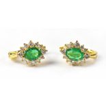 A pair of 18ct yellow gold emerald and diamond cluster earrings,