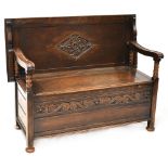 A 19th century and later oak monk's bench with bobbin turned supports,