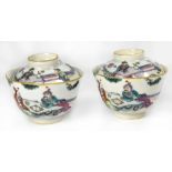 A pair of Chinese tea bowls and covers in the Famille Rose palette,