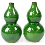A pair of Chinese green glazed double gourd vases with craquelure glaze, height 15cm (2).