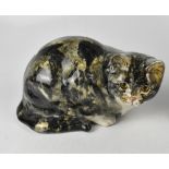 A Winstanley ceramic crouching cat with glass eyes, signed to base and numbered 5, height 19cm,