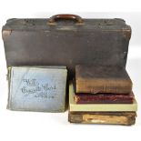 Three late 19th/early 20th century photograph albums containing black and white photographs,