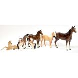 Various horse figures to include a Beswick Palomino,