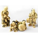 Three Japanese netsuke, one in the form of a man with a monkey at his feet,