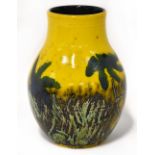 POOLE; a baluster vase with mustard ground and abstract long grass and wild flower decoration,