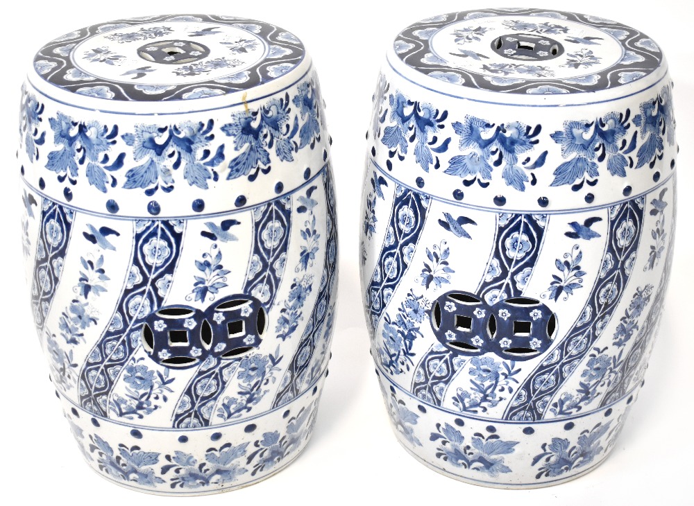 A pair of Oriental ceramic blue and white barrel-shaped reticulated garden seats, 47 x 35cm (2).