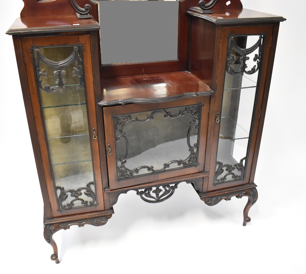 A Victorian mahogany mirror back display cabinet, shaped mirror above heavily carved canopy, - Image 2 of 2