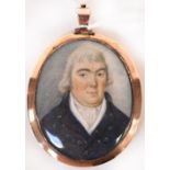 A 19th century yellow metal double portrait pendant,