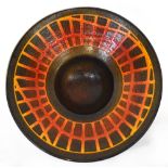 POOLE; a brown and amber ground bowl with recessed centre, to circular footed support,