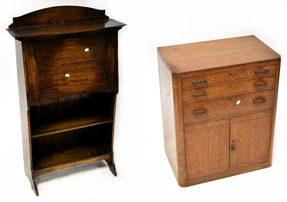 A mid-20th century oak student's desk with fall front and fitted interior above open shelves to the